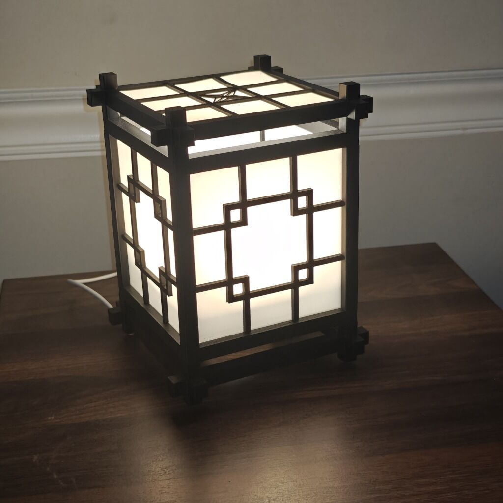 3D printed Kumiko-style LED lamp glowing warmly - Image 1